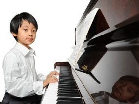 boy playing piano