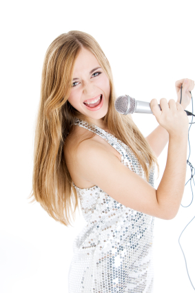 girl singing into microphone